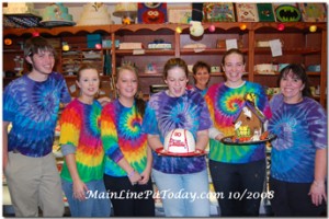 Denise and her Staff with Phillies Hat Cake and Gingerbread House